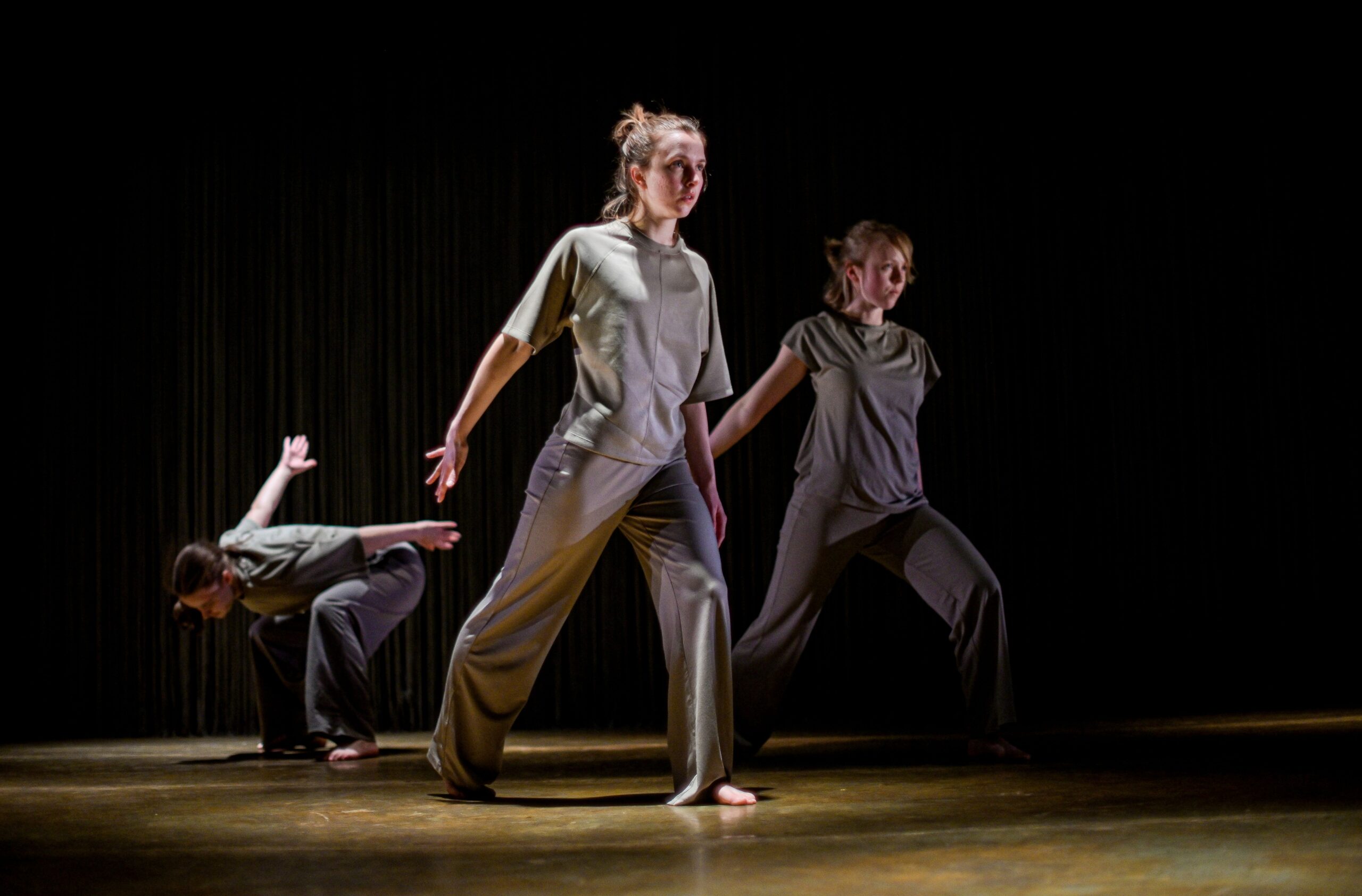 Three dancers in rehearsals